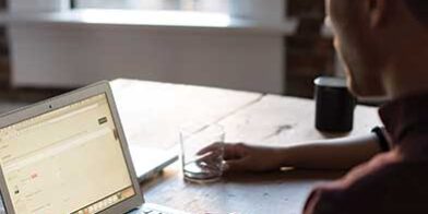 On-Computer man looking at computer