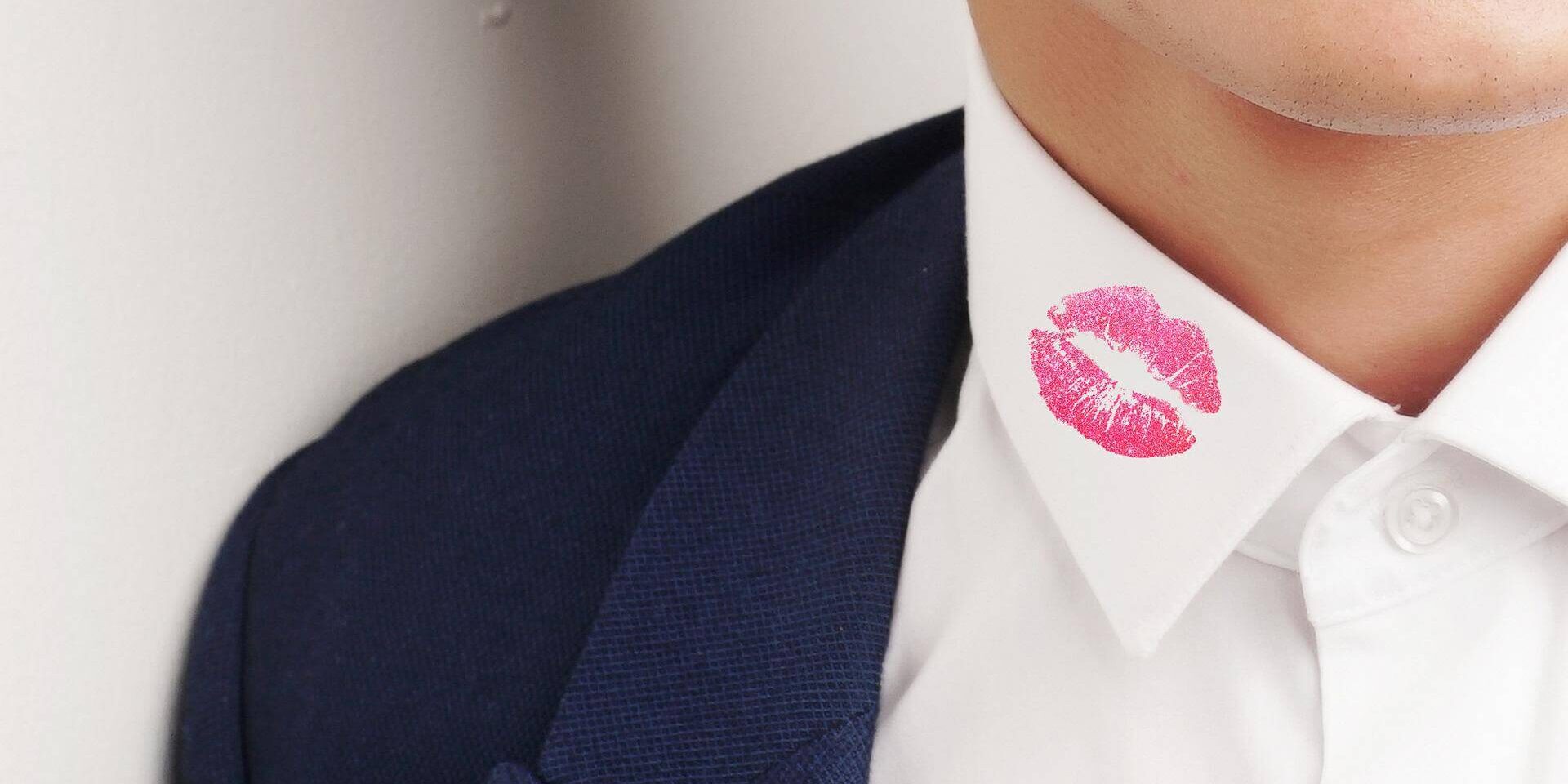 pink kiss mark on man's collar