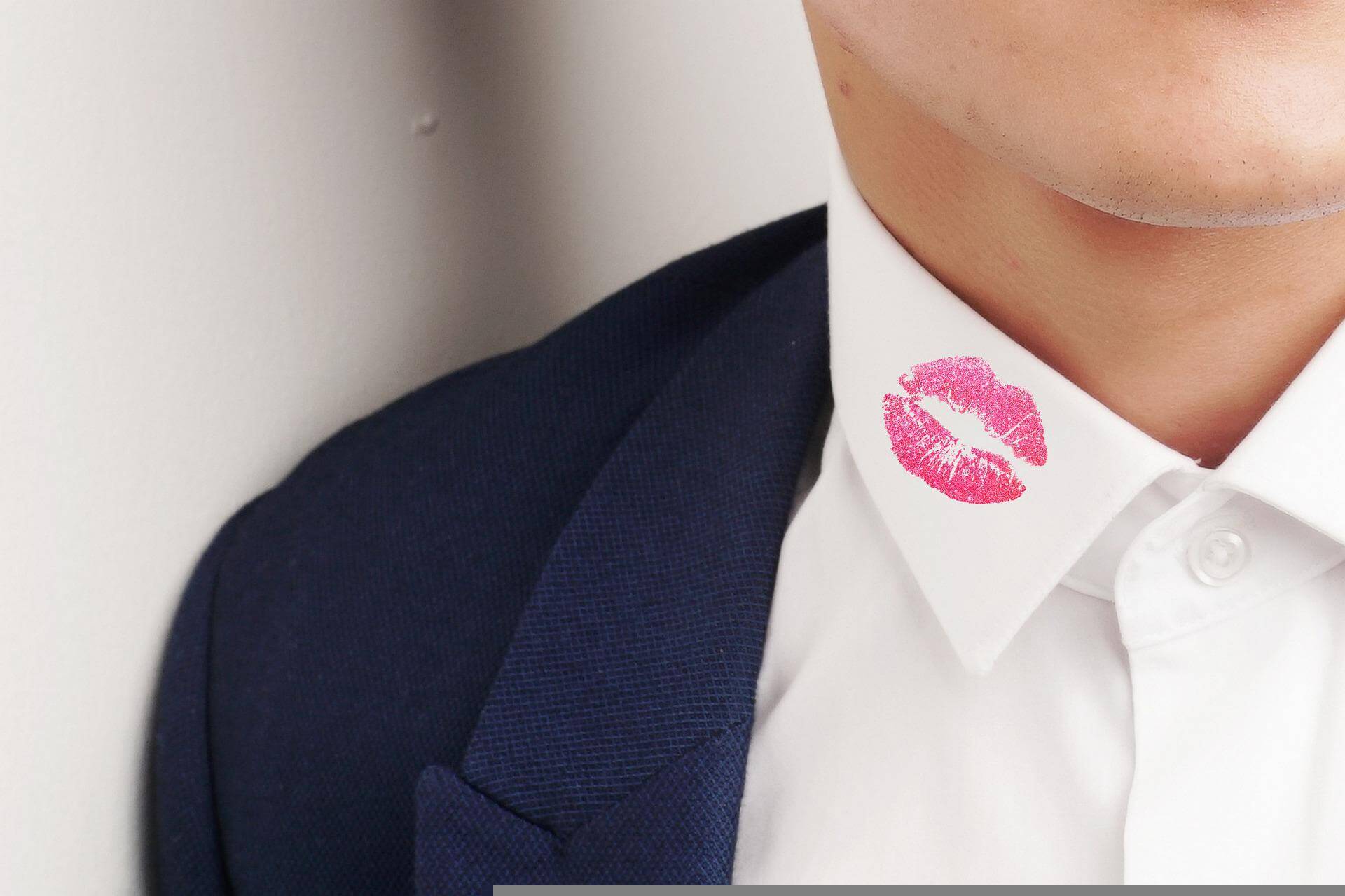 pink kiss mark on man's collar