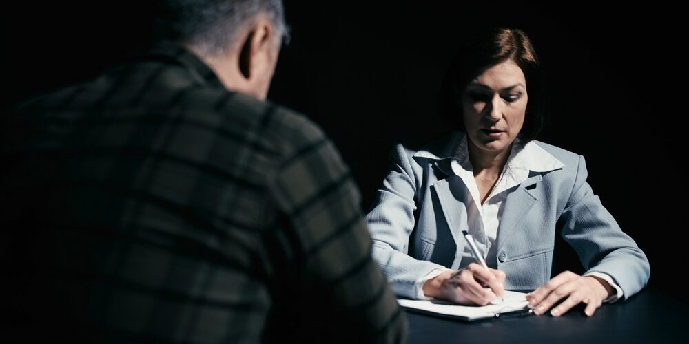 Woman,Lawyer,Writing,Down,Details,Of,The,Offense,To,Build