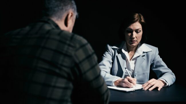 Woman,Lawyer,Writing,Down,Details,Of,The,Offense,To,Build